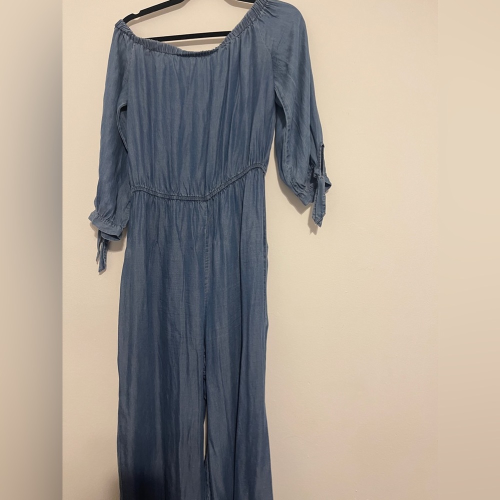Magnolia Sky Jumper in blue- never worn. While I removed the tags it’s new!